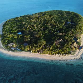 Aerial view of a palm-covered Mamanuca island